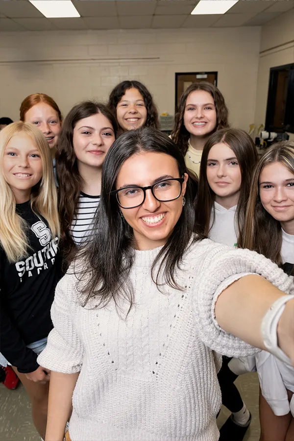 Gianna Trematerra taking a selfie with her students.