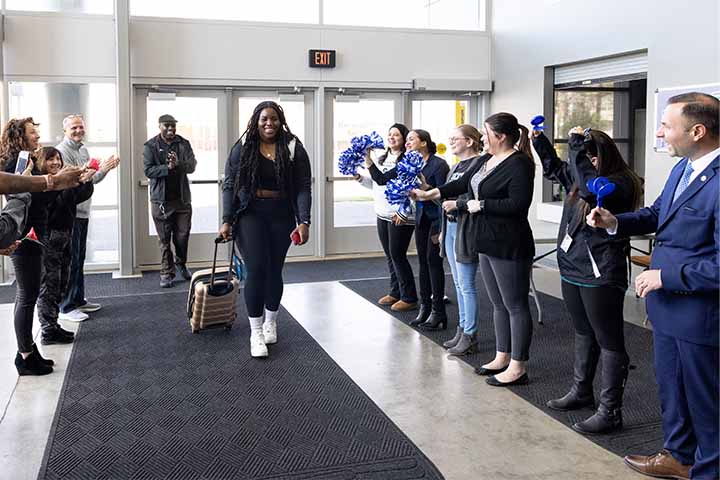 Shahyan Abraham being sent off to NCAA tournament by Stockton community members in the Sports Center