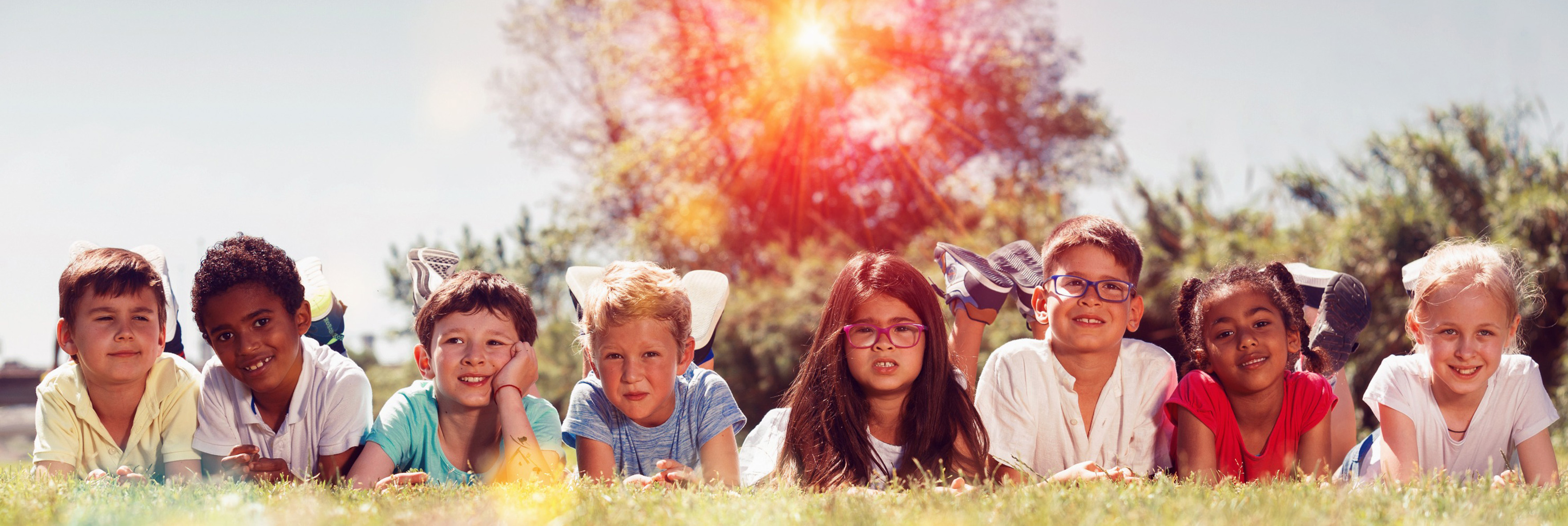 kids outside with hot usn blazing through trees