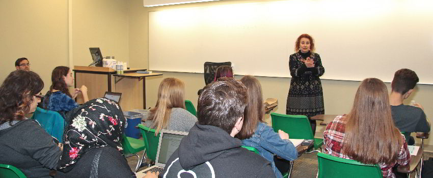 Faculty teaching in a classroom.