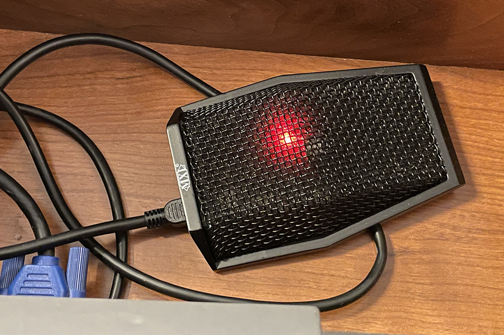 Classroom microphone stored in the podium drawer