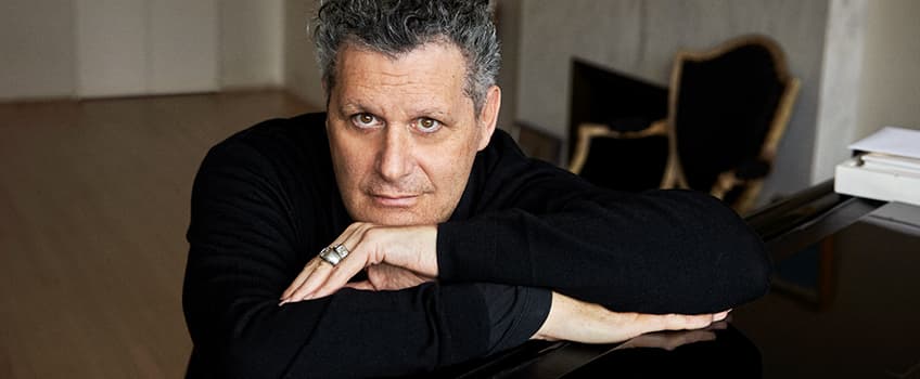 Isaac Mizrahi at a piano