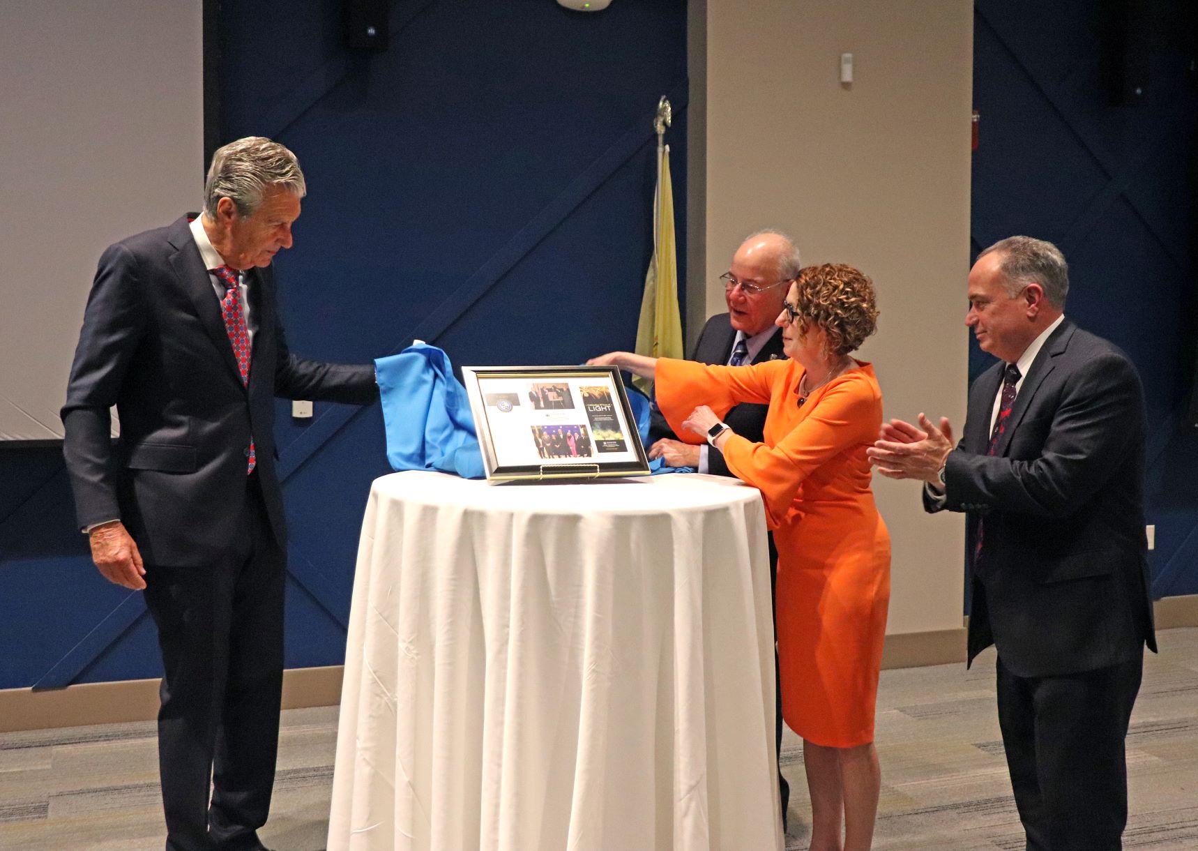 Lloyd D. Levenson is presented with a plaque to recognize his significant contributions to Stockton University and the community. Lloyd D. Levenson is presented with a plaque to recognize his significant contributions to Stockton University and the community.