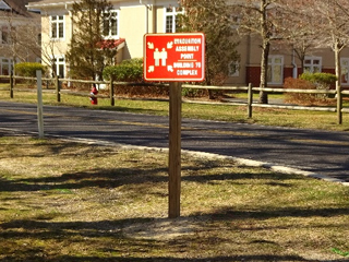 image of installed sign on grass near housing 4