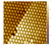 Figure 3. A grain boundary. Two orientations of crystals cannot meet perfectly. This defect is likely due to a single sphere filling the space of two (lower left). The scale is 8 µm × 8µm