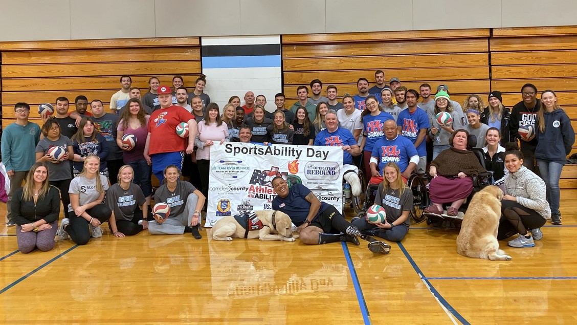 Participants of a sit-down volleyball tournament