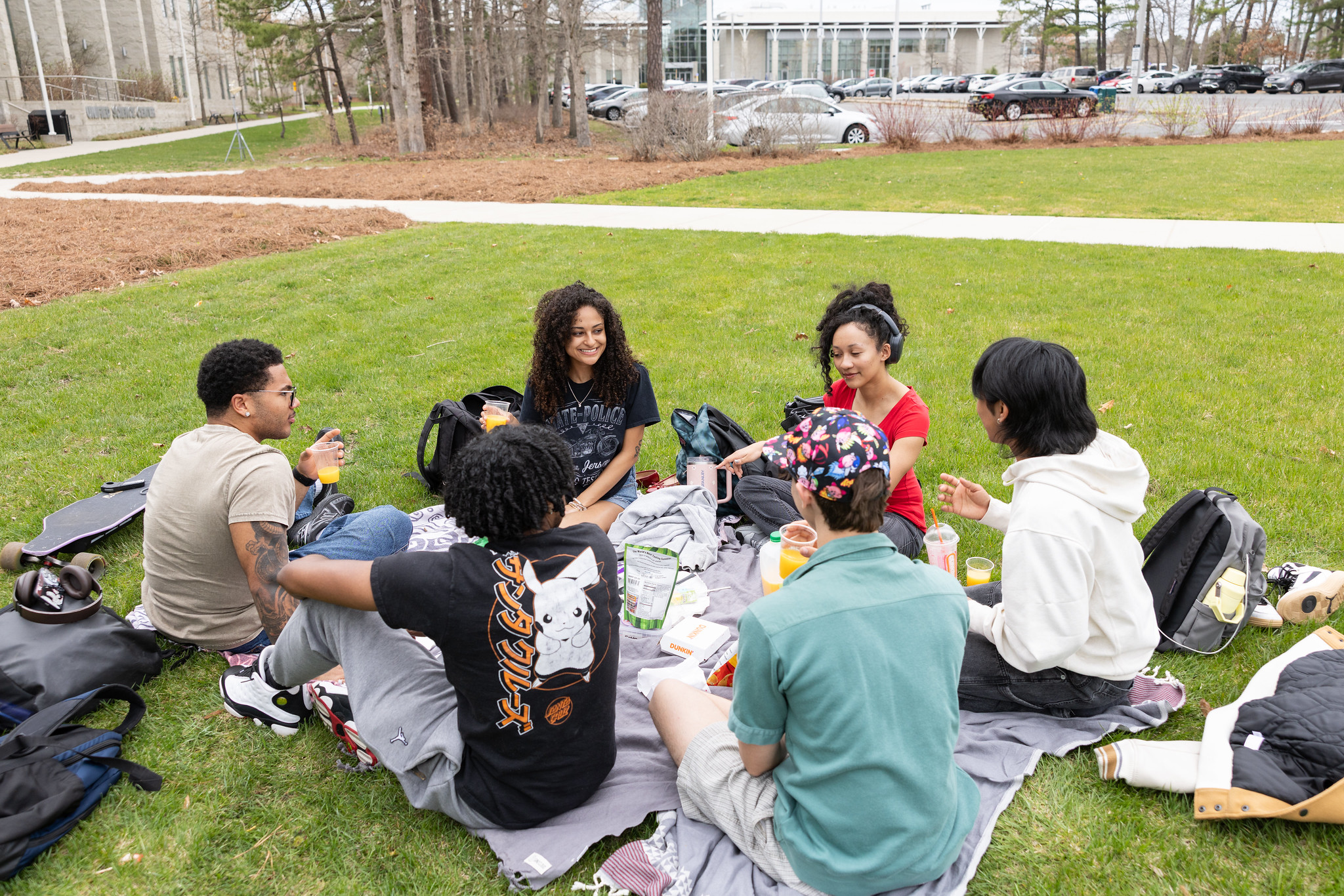 students hang on grass