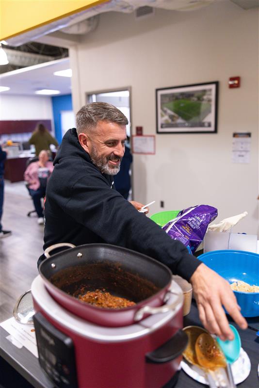 man getting chili