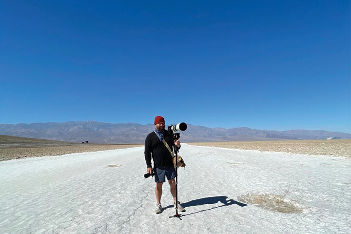 mark tesi in desert holding camera
