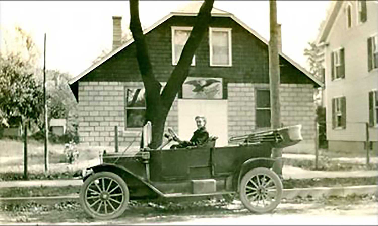 street view, black and white, antique car in frame
